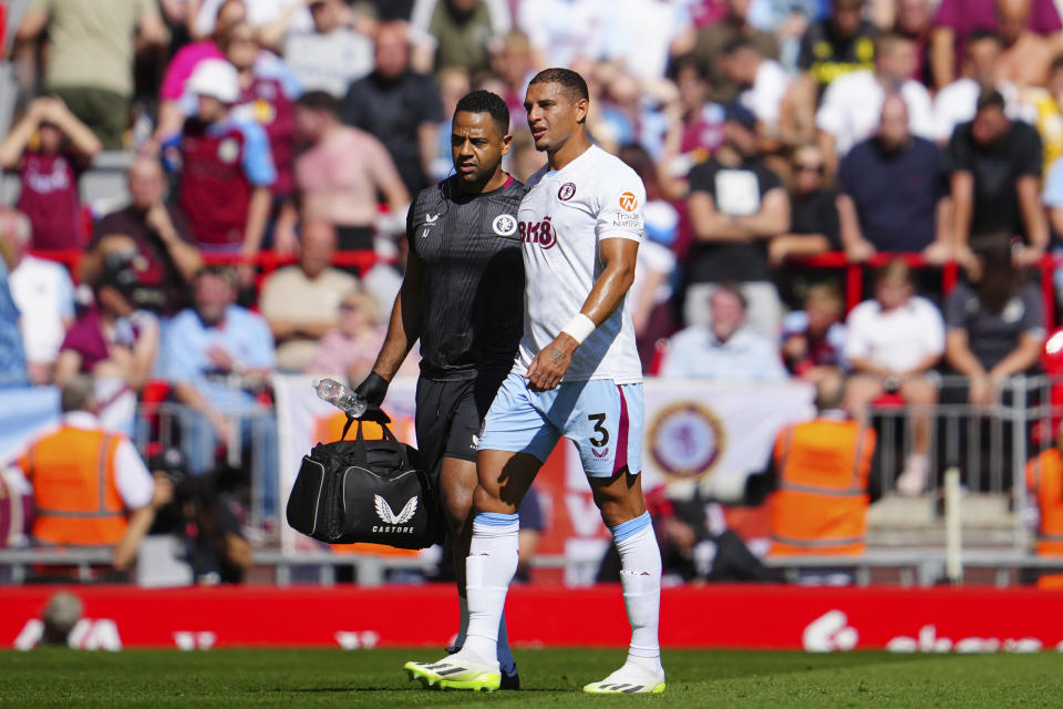 Aston Villa's Diego Carlos leaves the pitch after an injury during the English Premier League soccer match between Liverpool and Aston Villa at Anfield stadium in Liverpool, Sunday, Sept. 3, 2023. (AP Photo/Jon Super)