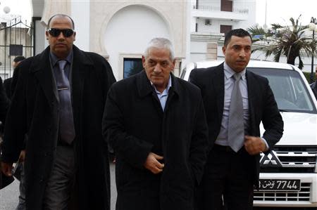 Hussein Abassi (C), head of the Tunisian General Labour Union (UGTT), arrives at a meeting in Tunis December 23, 2013. REUTERS/Zoubeir Souissi