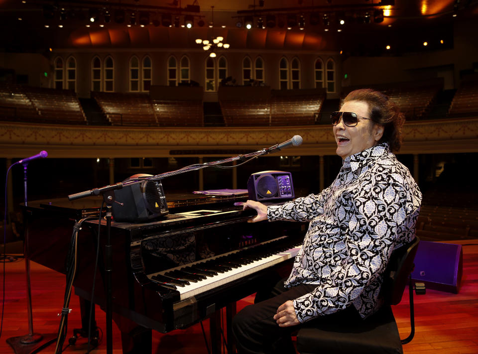 In this Jan. 16, 2019 photo, Ronnie Milsap poses for a photo on the stage of The Ryman Auditorium in Nashville, Tenn. Milsap's new album, “Ronnie Milsap: The Duets,” comes out on Friday. (Photo by Donn Jones/Invision/AP)