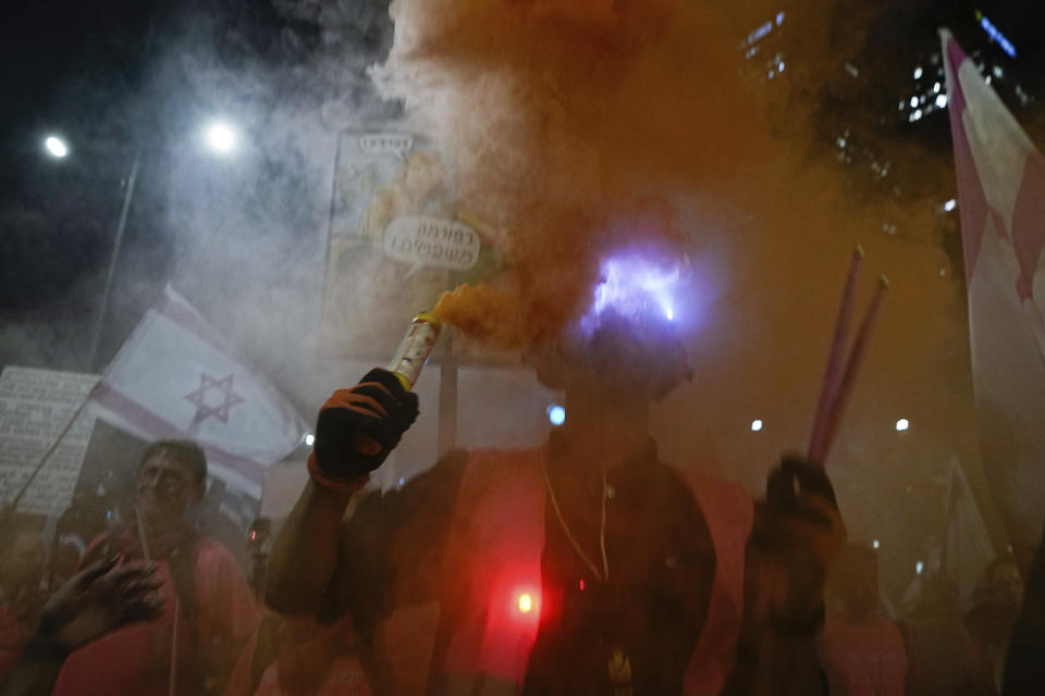 Israelis protest against plans by Prime Minister Benjamin Netanyahu's government to overhaul the judicial system, in Tel Aviv, Israel, Saturday, April 8, 2023. (AP Photo/Ariel Schalit)