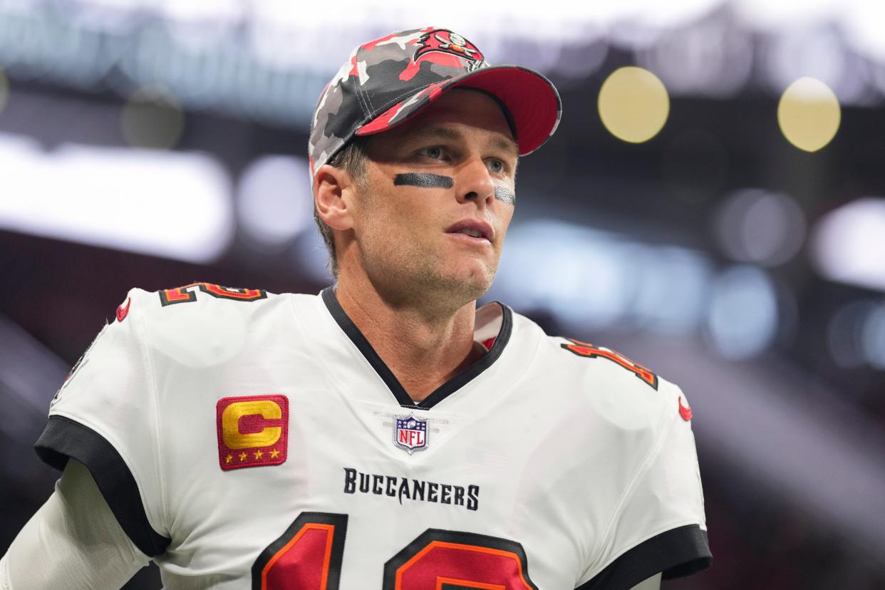 Tom Brady #12 of the Tampa Bay Buccaneers runs onto the field during introductions against the Atlanta Falcons at Mercedes-Benz Stadium on January 8, 2023 in Atlanta, Georgia.