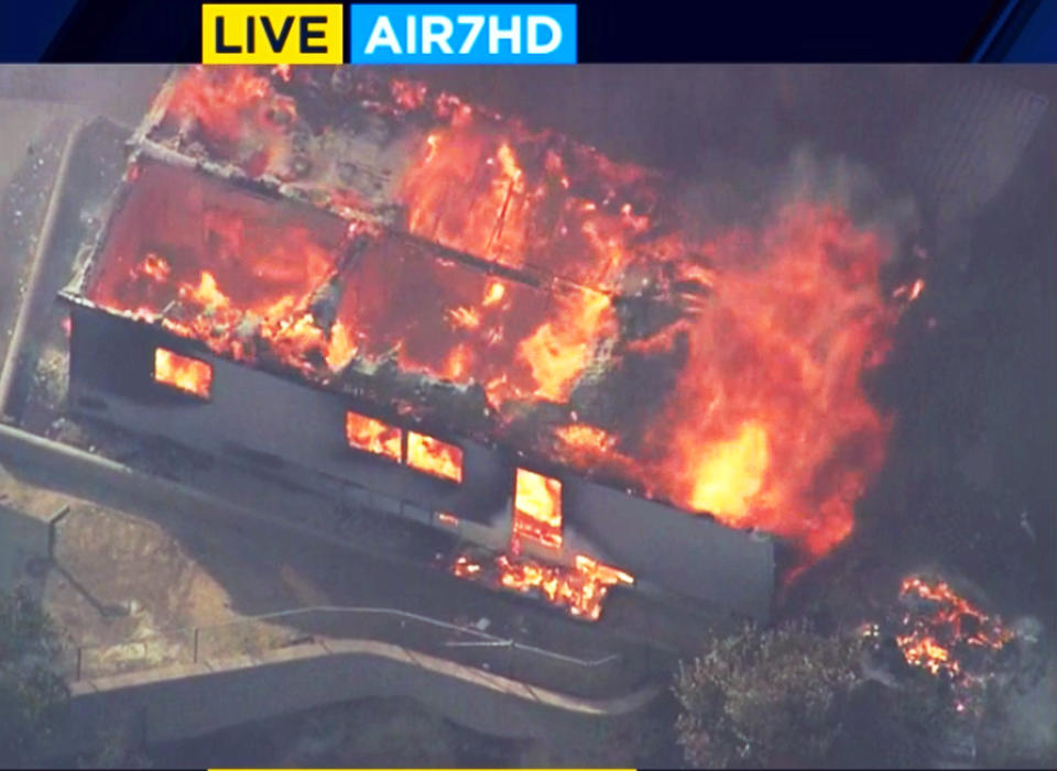 This photo from video provided by KABC-TV shows strong, gusting winds pushing flames through the Villa Calimesa mobile home park in Calimesa, Calif., southeast of San Bernardino, Thursday, Oct. 10, 2019. Multiple residences have burned in the fire that started shortly after noon. (KABC-TV via AP)