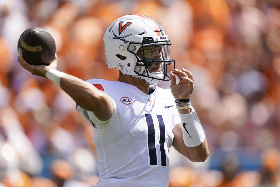 Virginia quarterback Tony Muskett (11) throws a pass against Tennessee in the first half of an NCAA college football game Saturday, Sept. 2, 2023, in Nashville, Tenn. (AP Photo/George Walker IV)
