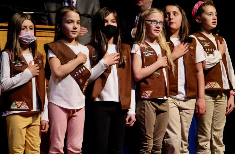 Girl Scouts of the United States of America troop members opened the Sandwich annual town meeting Monday with the Pledge of Allegiance.