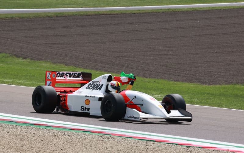 German Formula 1 driver Sebastian Vettel drives four laps of honor in the  the 1993 McLaren car of the late Ayrton Senna, who died 30 years ago in an accident in Imola, during the 2024 Emilia Romagna Grand Prix, at the Autodromo Internazionale Enzo e Dino Ferrari circuit. Hasan Bratic/dpa