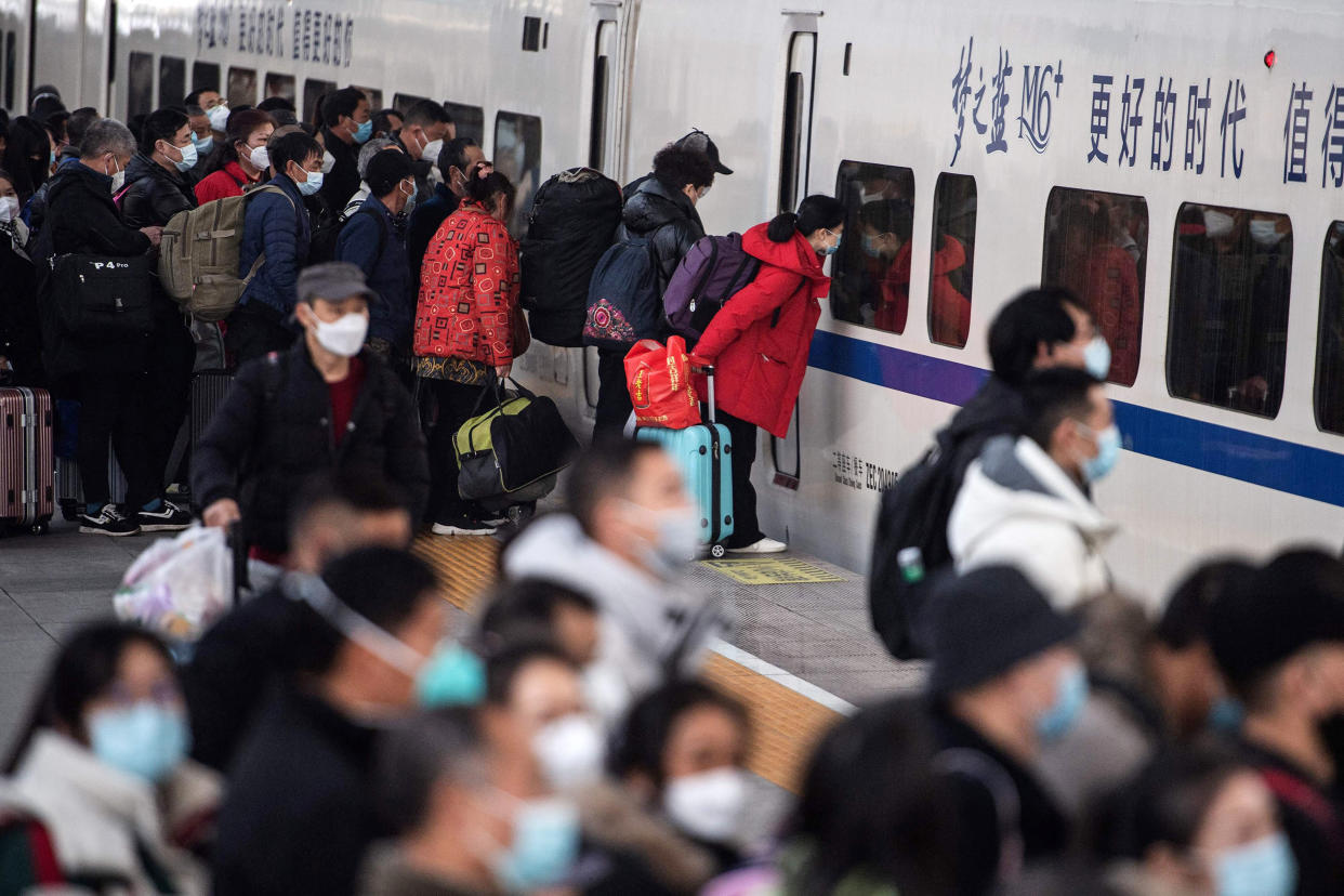 Passengers prepare to board a train at Hankou railway station in central China on Jan. 7, 2023 ahead of the Lunar New Year. (AFP - Getty Images)