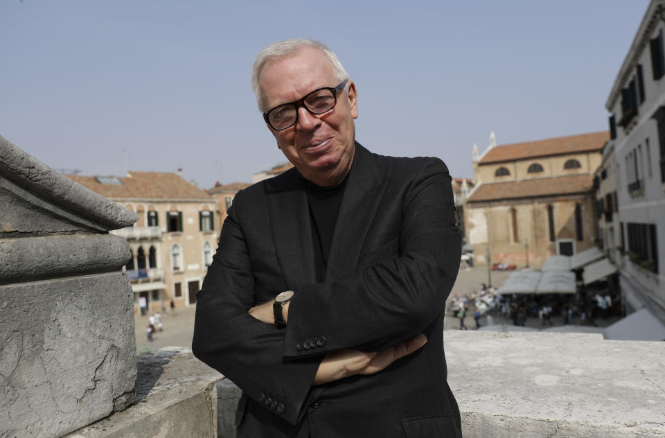 FILE - British architect David Chipperfield, is bringing his expertise in restoring historic buildings to the 500-year-old Procuratie Vecchie, poses at the Generali Group office during the media launch of the Procuratie Vecchie buildings and the Royal Gardens restoration, in St Mark's square in Venice, Italy on Oct. 4, 2017. Chipperfield is this year's recipient of the Pritzker Architecture Prize. (AP Photo/Luca Bruno, File)