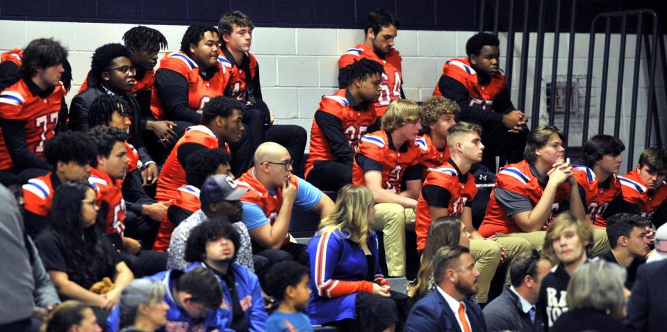 Teammates of Delmar football player Carter Figgs in the school gymnasium for Sunday's funeral service.