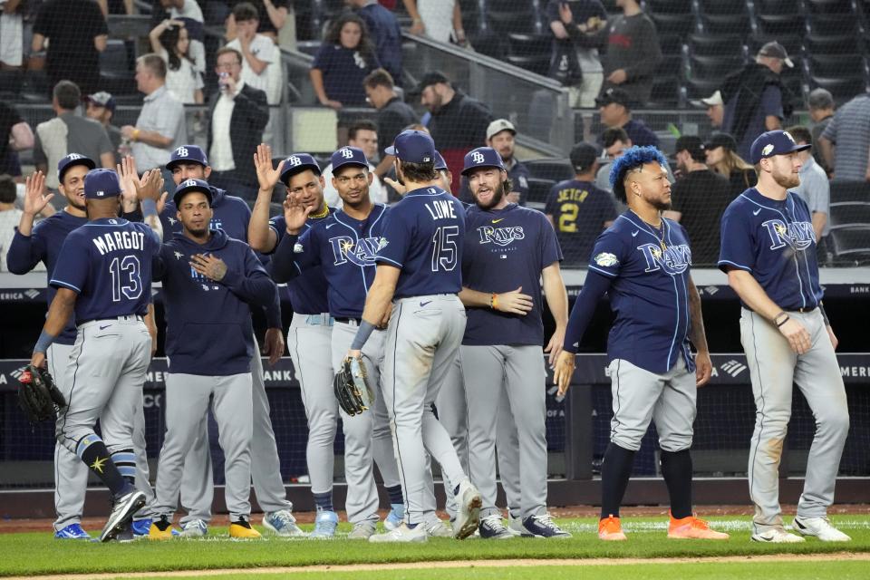 Tampa Bay Rays' Josh Lowe (15) celebrates with his teammates after the Rays defeated the New York Yankees in there a baseball game, Thursday, May 11, 2023, in New York. The Rays won 8-2. (AP Photo/Mary Altaffer)