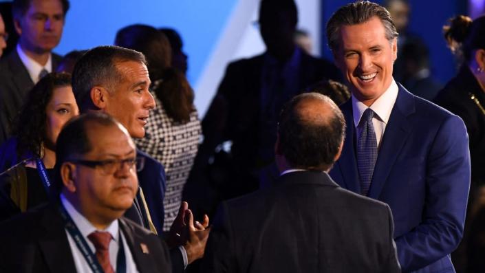 Los Angeles Mayor Eric Garcetti (2nd L) speaks to California Governor Gavin Newsom (R) ahead of a plenary session during the 9th Summit of the Americas in Los Angeles, California, June 9, 2022. <span class="copyright">Photo by PATRICK T. FALLON/AFP via Getty Images</span>