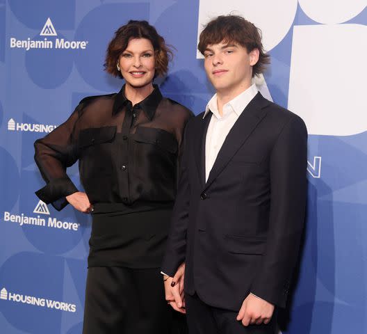 <p>Gary Gershoff/Getty</p> Linda Evangelista and son Augustin