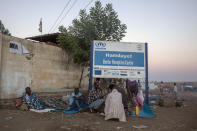 A Tigray refugees who fled the conflict in the Ethiopia's take shelter at Hamdeyat Transition Center near the Sudan-Ethiopia border, eastern Sudan, Thursday, Dec. 3, 2020. Ethiopian forces on Thursday blocked people from the country's embattled Tigray region from crossing into Sudan at the busiest crossing point for refugees, Sudanese forces said.(AP Photo/Nariman El-Mofty)