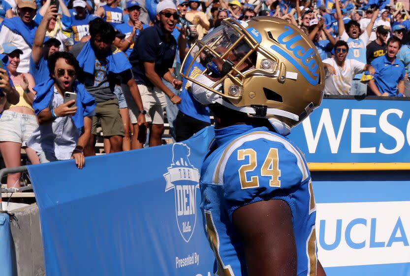 PASADENA, CALIF. - OPC T. 8, 2022. UCLA cornerback Jaylin Davies celebrates after scooping up a fumble by Utah quarterback Cameron Rising and returning it to the Utah one yard line in the fourth quarter Saturday, Oct. 8, 2022, at the Rose Bowl in Pasadena. (Luis Sinco / Los Angeles Times)