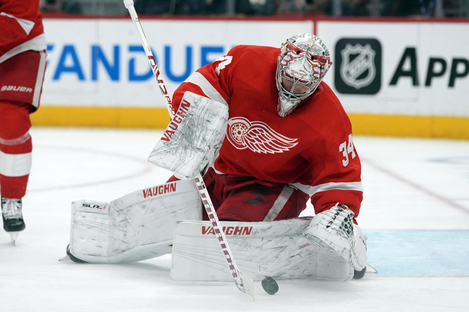Detroit Red Wings goaltender Alex Lyon (34) stops a shot on goal during the first period of an NHL hockey game against the Philadelphia Flyers, Thursday, Jan. 25, 2024, in Detroit. (AP Photo/Carlos Osorio)