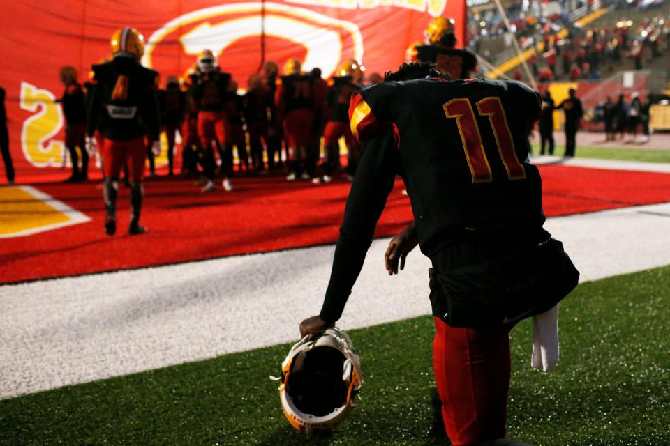 Clarke Central's Lucian Anderson III (11) prays before the start of a GHSA high school football between Cedar Shoals and Clarke Central in Athens on Oct. 28, 2021.