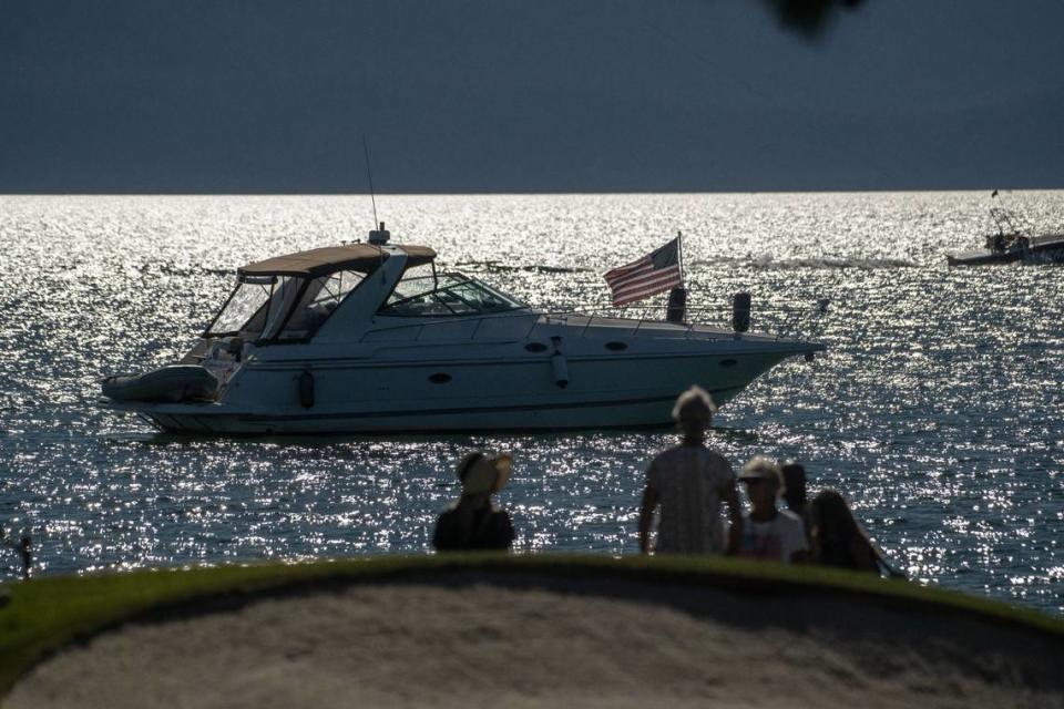 The sun sets on Lake Tahoe as boats float on Thursday, July 13, 2023, as celebrities take their final practice rounds for the American Century Championship celebrity golf tournament at Edgewood Tahoe Golf Course in Stateline, Nev. Hector Amezcua/hamezcua@sacbee.com