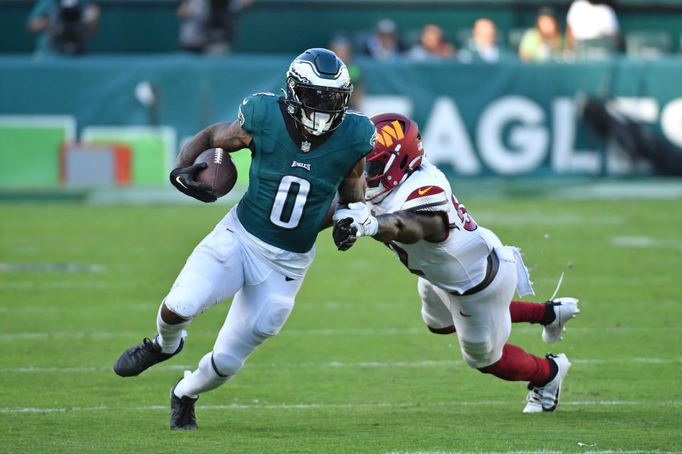Oct 1, 2023; Philadelphia, Pennsylvania, USA; Philadelphia Eagles running back <a class="link " href="https://sports.yahoo.com/nfl/players/32705" data-i13n="sec:content-canvas;subsec:anchor_text;elm:context_link" data-ylk="slk:D’Andre Swift;sec:content-canvas;subsec:anchor_text;elm:context_link;itc:0">D’Andre Swift</a> (0) avoids tackle by <a class="link " href="https://sports.yahoo.com/nfl/teams/washington/" data-i13n="sec:content-canvas;subsec:anchor_text;elm:context_link" data-ylk="slk:Washington Commanders;sec:content-canvas;subsec:anchor_text;elm:context_link;itc:0">Washington Commanders</a> linebacker <a class="link " href="https://sports.yahoo.com/nfl/players/33407" data-i13n="sec:content-canvas;subsec:anchor_text;elm:context_link" data-ylk="slk:Jamin Davis;sec:content-canvas;subsec:anchor_text;elm:context_link;itc:0">Jamin Davis</a> (52) in overtime at Lincoln Financial Field. Mandatory Credit: Eric Hartline-USA TODAY Sports