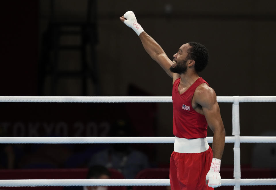 The United States' Duke Ragan celebrates after winning his fight against Ghana's Samuel Takyi for their men's featherweight 57-kg semifinal boxing match at the 2020 Summer Olympics, Tuesday, Aug. 3, 2021, in Tokyo, Japan. (AP Photo/Themba Hadebe)