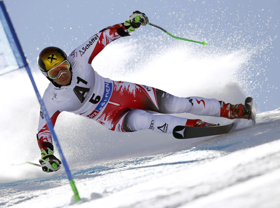 Austria's Marcel Hirscher competes during the first run of an alpine men's World Cup giant slalom in Soelden, Austria, Sunday, Oct. 26, 2014. Overall champion Marcel Hirscher held on to his first-run lead to win the season-opening World Cup giant slalom by a huge margin on Sunday. (AP Photo/Shinichiro Tanaka)