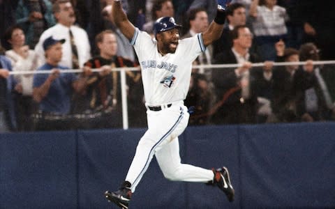 Toronto Blue Jays' Joe Carter celebrates his game winning three-run home run in the ninth inning of Game 6 of the 1993 World Series against the Philadelphia Phillies - Credit: AP