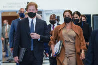 Prince Harry and Meghan, the Duke and Duchess of Sussex are escorted as they leave the United Nations headquarters after a visit during 76th session of the United Nations General Assembly, Saturday, Sept. 25, 2021. (AP Photo/Mary Altaffer)