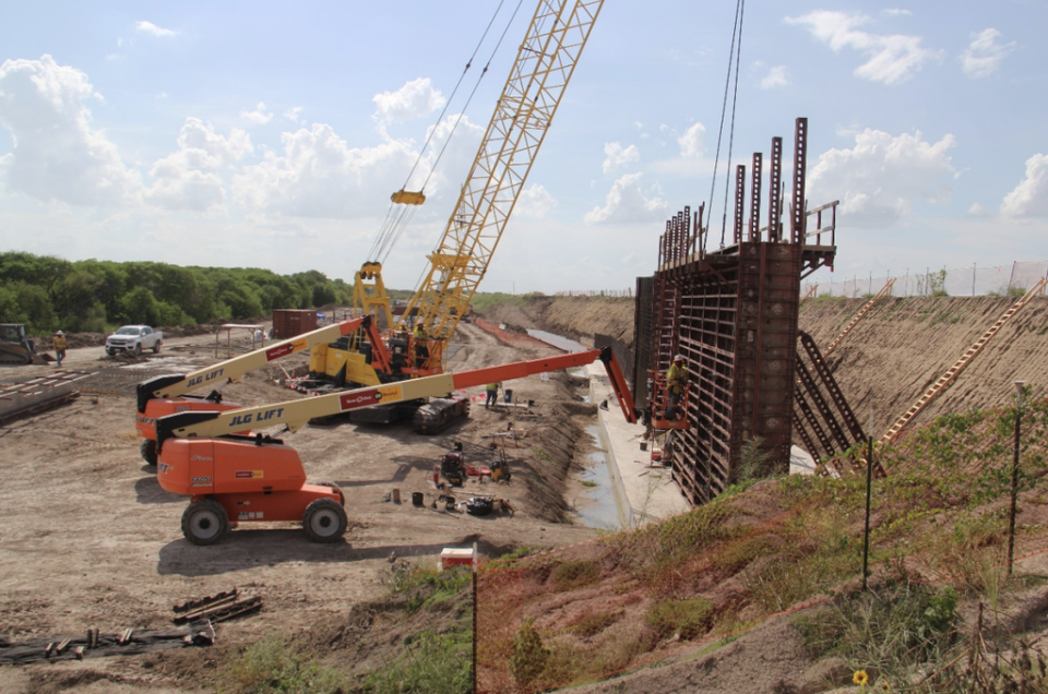 Recent construction converting a flood control levee near Abram, Texas into a ‘levee-border wall’. The slope of the former levee is indicated by the grassy slope on right (Scott Nichol)