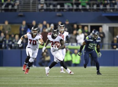 Nov 20, 2017; Seattle, WA, USA; Atlanta Falcons running back Tevin Coleman (26) carries the ball against the Seattle Seahawks during the first half at CenturyLink Field. Atlanta defeated Seattle 34-31. Steven Bisig-USA TODAY Sports