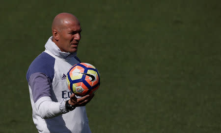 Football Soccer- Real Madrid training - Valdebebas training grounds, Madrid, Spain - 22/04/17 Real Madrid's coach Zinedine Zidane attends training session. REUTERS/Sergio Perez