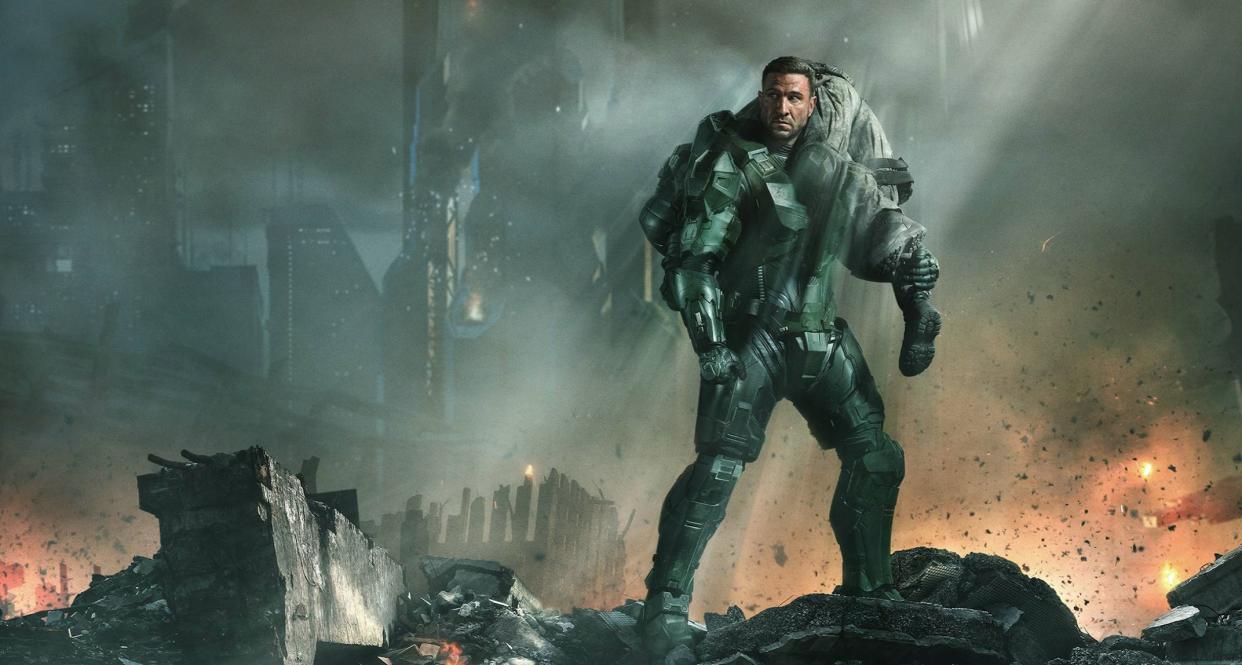  Illustration of a man wearing futuristic green armor in a bombed-out city. 