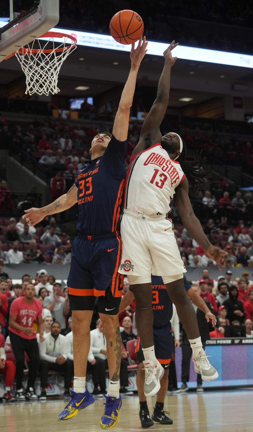 Feb 26, 2023; Columbus, OH, USA; Ohio State Buckeyes guard Isaac Likekele (13) shoots past Illinois Fighting Illini forward Coleman Hawkins (33) during NCAA basketball game Feb. 26, 2023 at Value City Arena. Mandatory Credit: Doral Chenoweth-The Columbus Dispatch