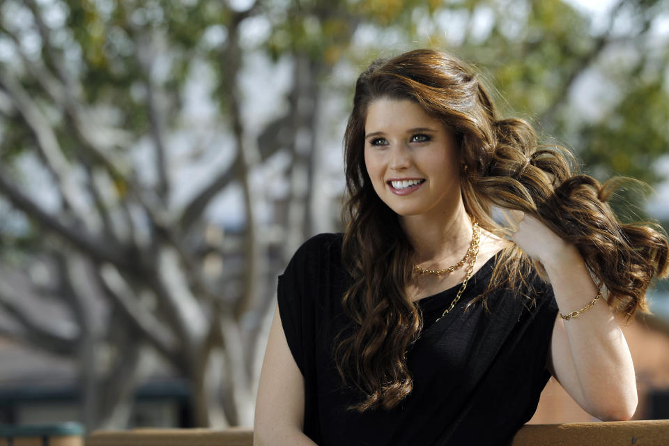 Katherine Schwarzenegger poses for a portrait in Los Angeles March 17, 2011. Schwarzenegger is not your average 21 year-old college student. She is the first-born child of ex-California Governor and Hollywood movie star Arnold Schwarzenegger and his wife Maria Shriver. But in her own right, Katherine is an author, and she raises money for charities including her uncle Anthony Shriver's group, Best Buddies, a volunteer program to support people with intellectual and developmental disabilities. Picture taken March 17, 2011. To match Reuters Life! PEOPLE-KATHERINESCHWARZENEGGER REUTERS/Mario Anzuoni (UNITED STATES - Tags: ENTERTAINMENT SOCIETY)