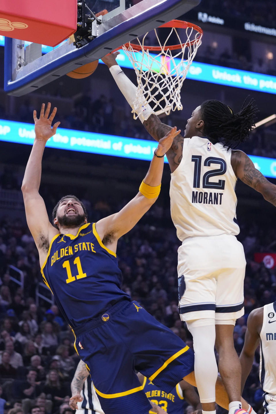 Memphis Grizzlies guard Ja Morant, right, blocks a shot by Golden State Warriors forward Klay Thompson during the first half of an NBA basketball game in San Francisco, Wednesday, Jan. 25, 2023. (AP Photo/Godofredo A. Vásquez)