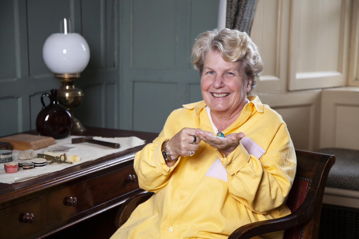 Sandi Toksvig holding a world map marble in Darwin's Room at Christ's College, Cambridge. (Graham CopeKoga/ Cambridge University/ PA)