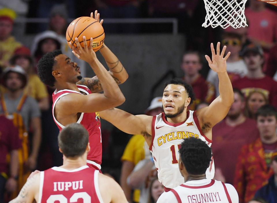 IUPUI Jaguars guard Vincent Brady II (1) shoots around Iowa State University Cyclones guard Jaren Holmes (13) during the first half of the season-opening home game at Hilton Coliseum, Monday , November 7, 2022, in Ames, Iowa.  Photo by Nirmalendu Majumdar/Ames Tribune