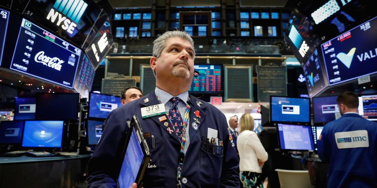 Traders work on the floor of the New York Stock Exchange (NYSE) in New York, U.S., December 6, 2017.