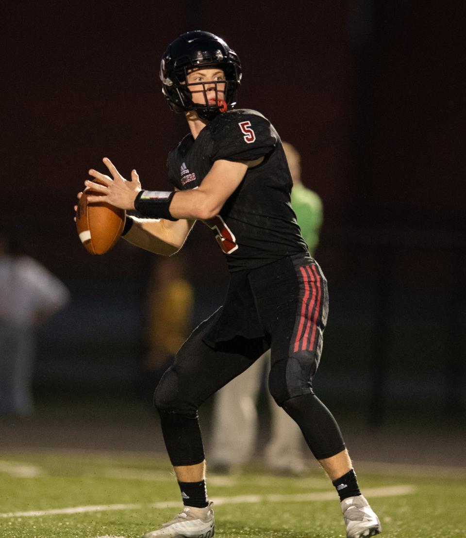 Southridge's Hudson Allen (5) looks for a pass as the Southridge Raiders play the Gibson Southern Titans at Southridge High School in Huntingburg, Ind., Friday evening, Sept. 16, 2022. 