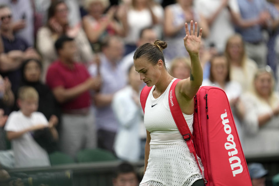 Aryna Sabalenka of Belarus leaves the court after losing to Tunisia's Ons Jabeur in their women's semifinal singles match on day eleven of the Wimbledon tennis championships in London, Thursday, July 13, 2023. (AP Photo/Kin Cheung)