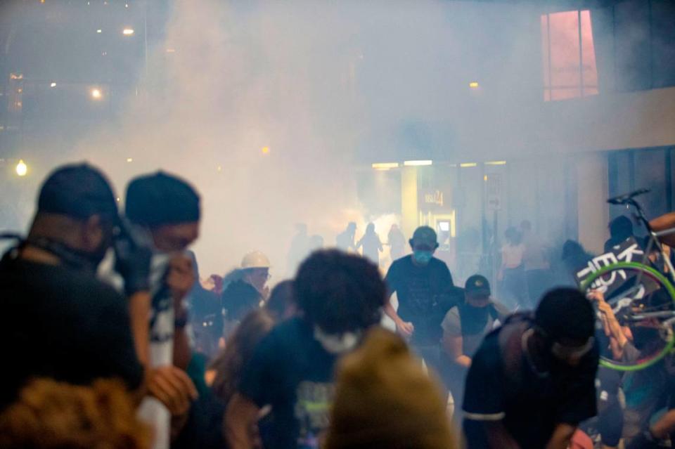 Tear gas clouds envelops protesters who said they were trapped on 4th Street by police, who unleased a barrage of chemical agents.