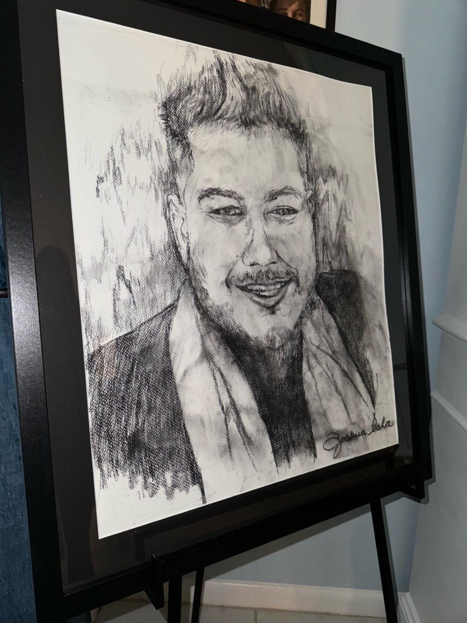 Local artist Joshua Isla of Portrait Therapy Studios presented the family with a drawing of Nito Longinos that now hangs in his parents' home.