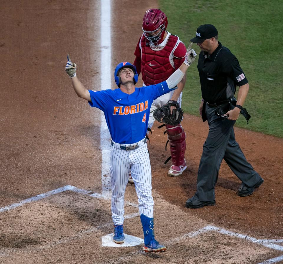 Florida's outfielder Jud Fabian (4) celebrates after his home runs against Oklahoma on Sunday night in Gainesville, Fla.