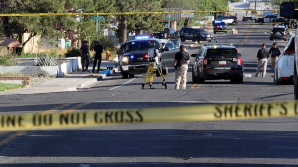 PHOTO: Investigators work along a residential street following a deadly shooting, May 15, 2023, in Farmington, N.M. (Susan Montoya Bryan/AP)