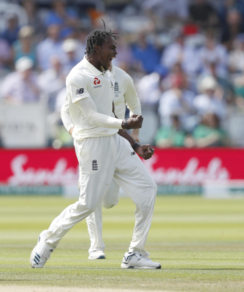 England's Jofra Archer celebrates after taking the wicket of Australia's Tim Paine caught by England's Jos Buttler during play on day four of the 2nd Ashes Test cricket match between England and Australia at Lord's cricket ground in London, Saturday, Aug. 17, 2019. (AP Photo/Alastair Grant)