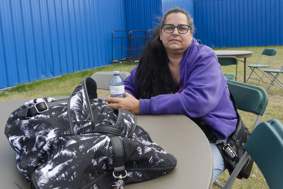 Karen Nicolai, a Fort Nelson, B.C. evacuee, rests at the North Peace Arena in Fort St. John , B.C.
