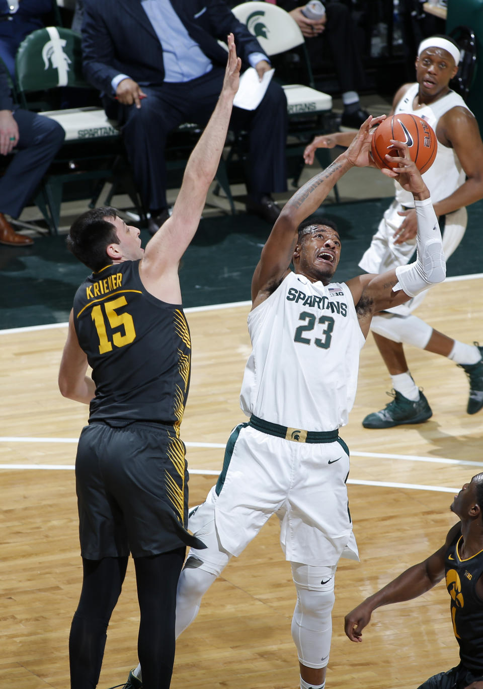 Michigan State's Xavier Tillman, right, and Iowa's Ryan Kriener (15) vie for a rebound during the second half of an NCAA college basketball game, Tuesday, Feb. 25, 2020, in East Lansing, Mich. Michigan State won 78-70. (AP Photo/Al Goldis)