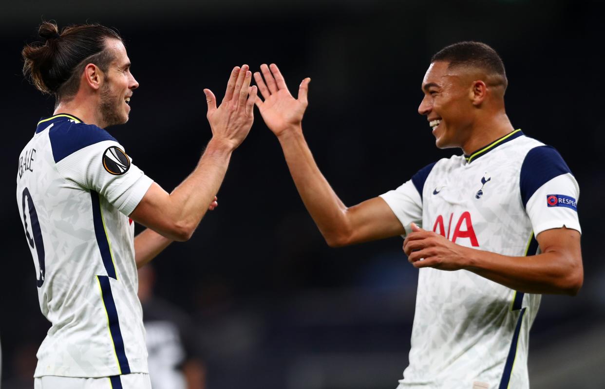 Gareth Bale celebrates with team mate Carlos Vinicius (Getty)