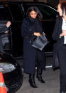 For dinner with friends in NYC, Meghan wore a Victoria Beckham coat, Stella McCartney bag and Hatch maternity jeans. A new pair of velvet boots finished off the look. [Photo: Getty]