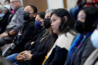 Residents of Gila River Indian Community listen during a "Road to Healing" event, Friday, Jan. 20, 2023, at the Gila Crossing Community School in Laveen, Ariz. The "The Road to Healing," is a year-long tour across the country to provide Indigenous survivors of the federal Indian boarding school system and their descendants an opportunity to share their experiences. (AP Photo/Matt York)