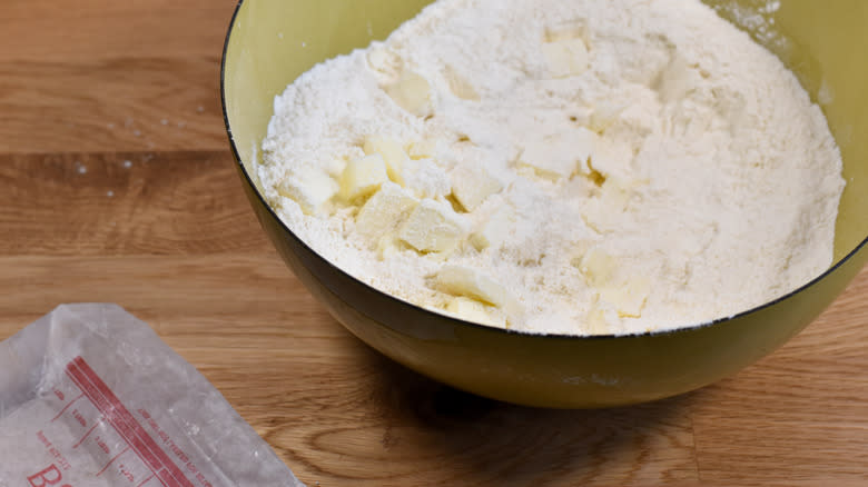 butter cubes in flour mixture