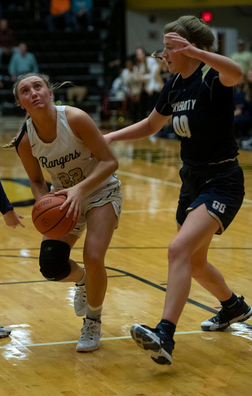 Forest Park's Gabey Gray (22), left, eyes the basket as University's Kelsey Dubois (0) guards during the IHSAA girls basketball Class 2A semistate championship at Jasper High School in Jasper, Ind., Saturday afternoon, Feb. 19, 2022.