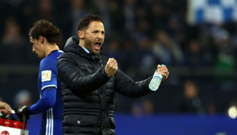 Schalke's head coach Domenico Tedesco cheers his team during their German first division Bundesliga match against Augsburg, in Gelsenkirchen, on December 13, 2017